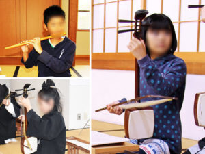 胡弓や笛の鳴物を練習する子供たち